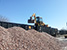  Iowa Interstate crews unload quartzite ballast for grade crossing projects.
